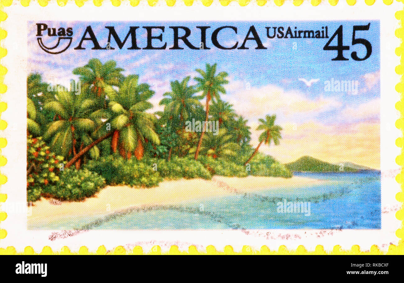 Tropical beach on american postage stamp Stock Photo - Alamy