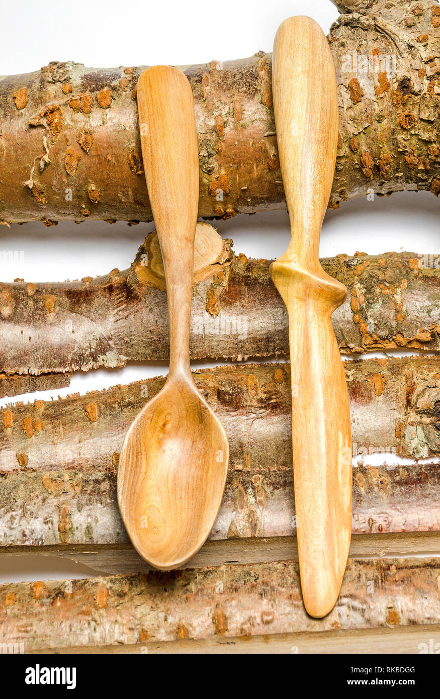 urban wood carving spoon and knife cherry wood Stock Photo