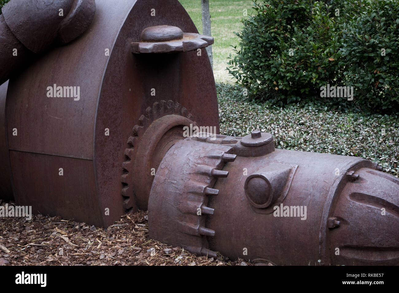 A royalty free image of a robot statue that has been rusted and lying on the ground. Stock Photo