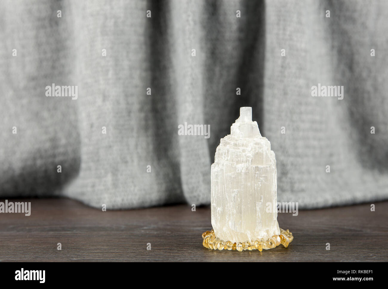 Naturally carved mineral stone Selenite tower has healing on cleansing properties. Also used for recharging other mineral crystal stones. Stock Photo
