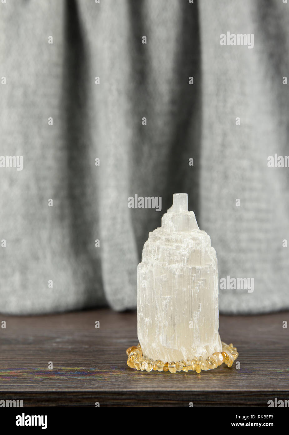 Naturally carved mineral stone Selenite tower has healing on cleansing properties. Also used for recharging other mineral crystal stones. Stock Photo