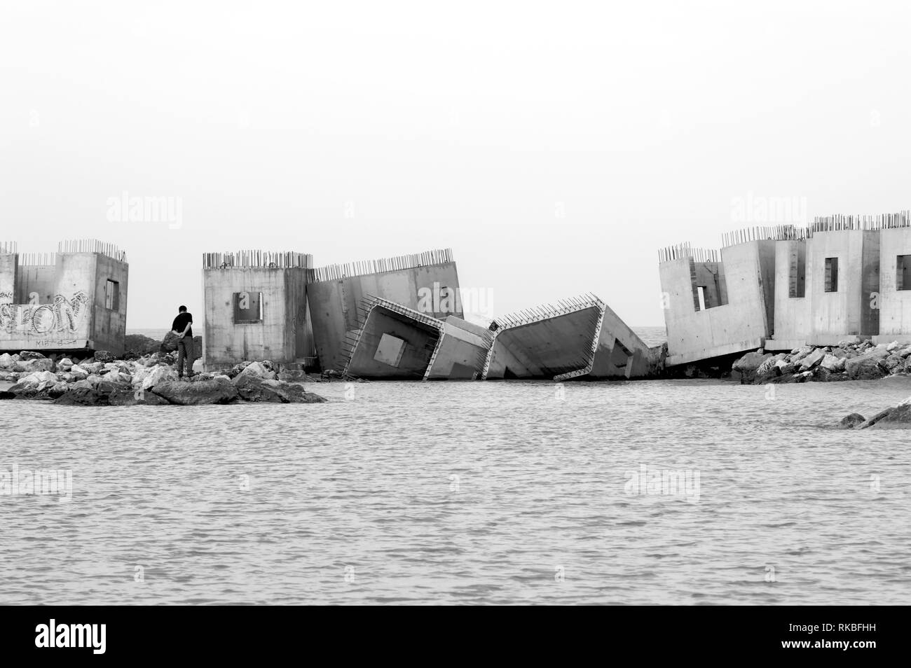 Italy. Concrete blocks on sea water Stock Photo