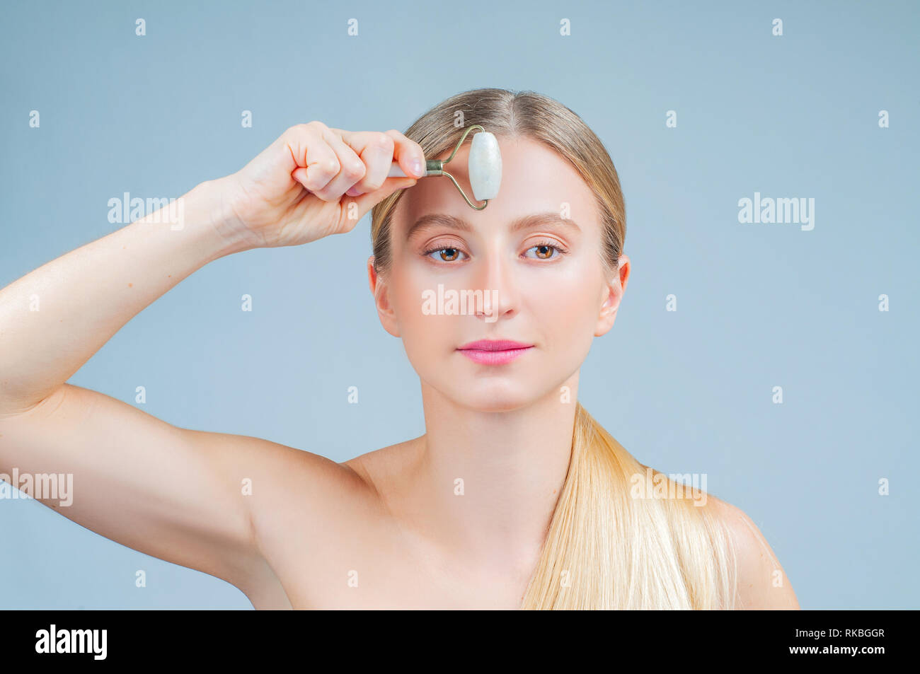 Face massage. Facial beauty treatment. Beautiful woman getting massage