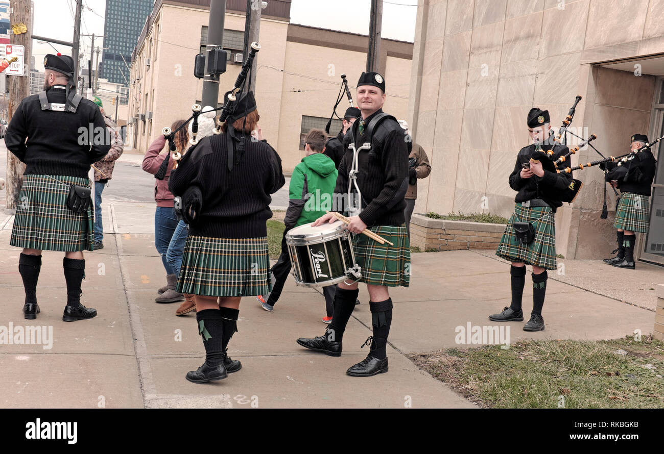 Irish band in kilts warms up prior to participating in the St. Patrick's Day Parade in downtown Cleveland, Ohio, USA. Stock Photo