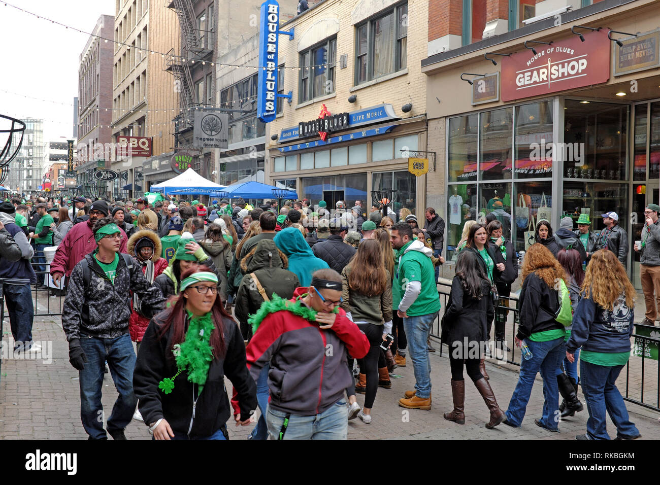 St. Patrick's Day festivities spill-over into East 4th Street in downtown Cleveland, Ohio, USA during the city-wide celebration. Stock Photo