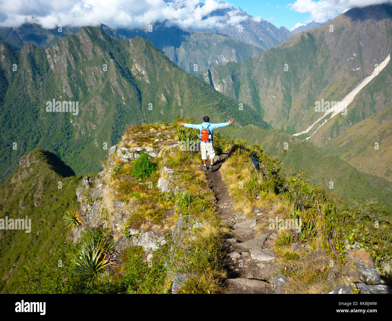 Free man in nature after achieving to get to the peak of Machu Picchu Stock Photo