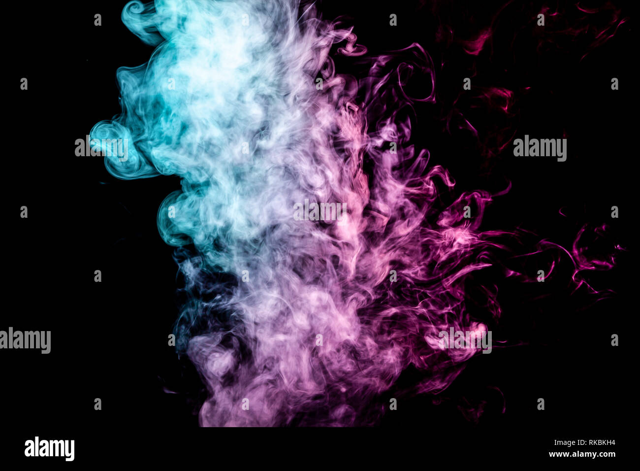 Blue and pink bomb smoke on black isolated background Stock Photo - Alamy