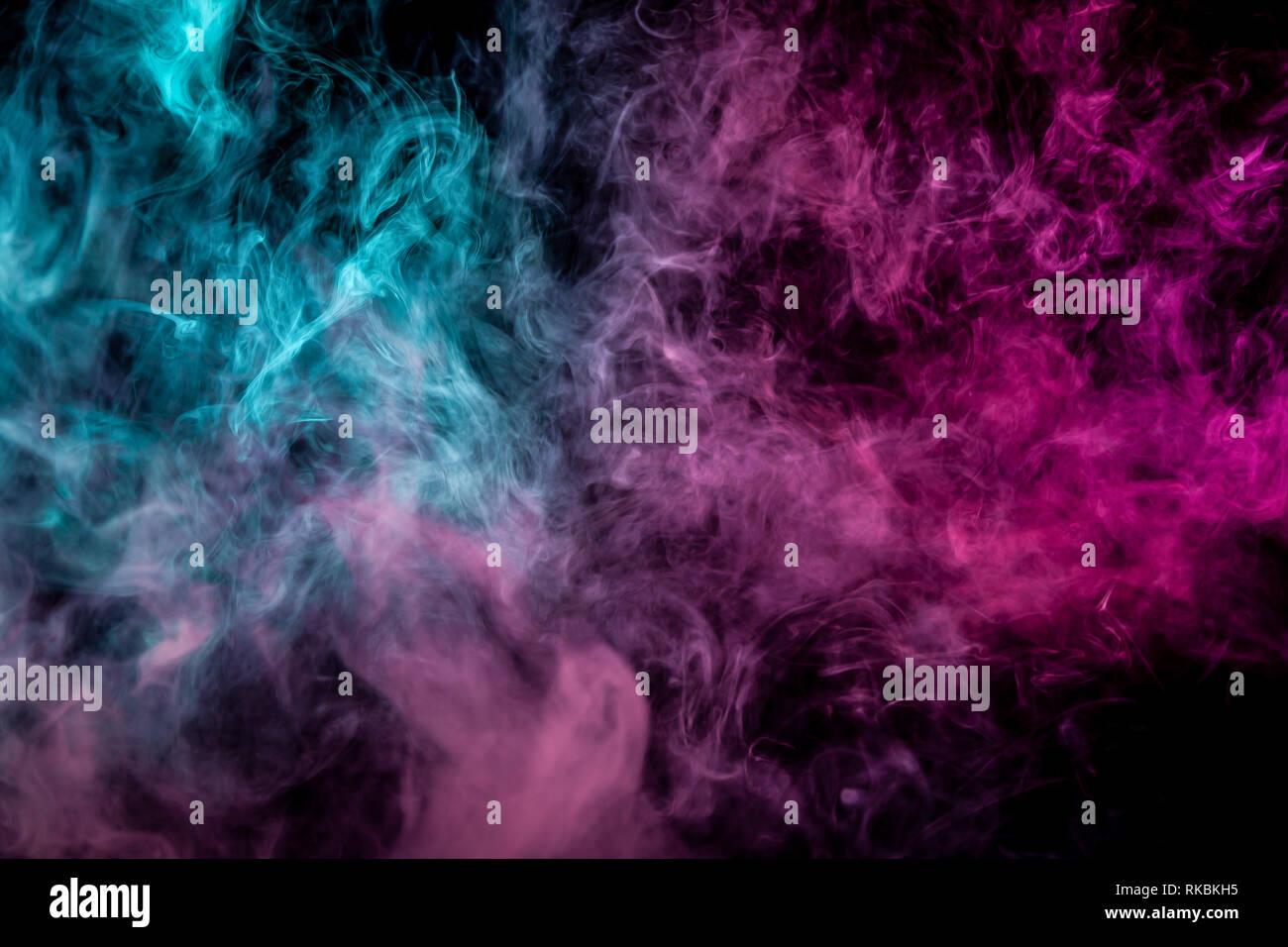 Blue and pink bomb smoke on black isolated background Stock Photo - Alamy