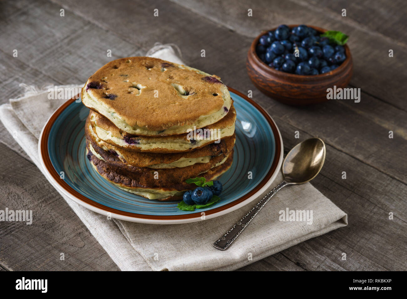 Homemade vegan pancakes with blueberries for breakfast. Stock Photo