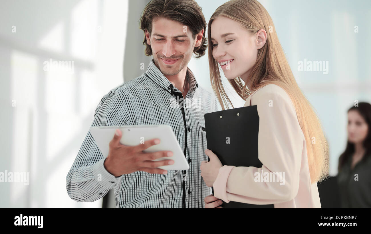 closeup.Office workers looking at tablet computer. people and technology. Stock Photo