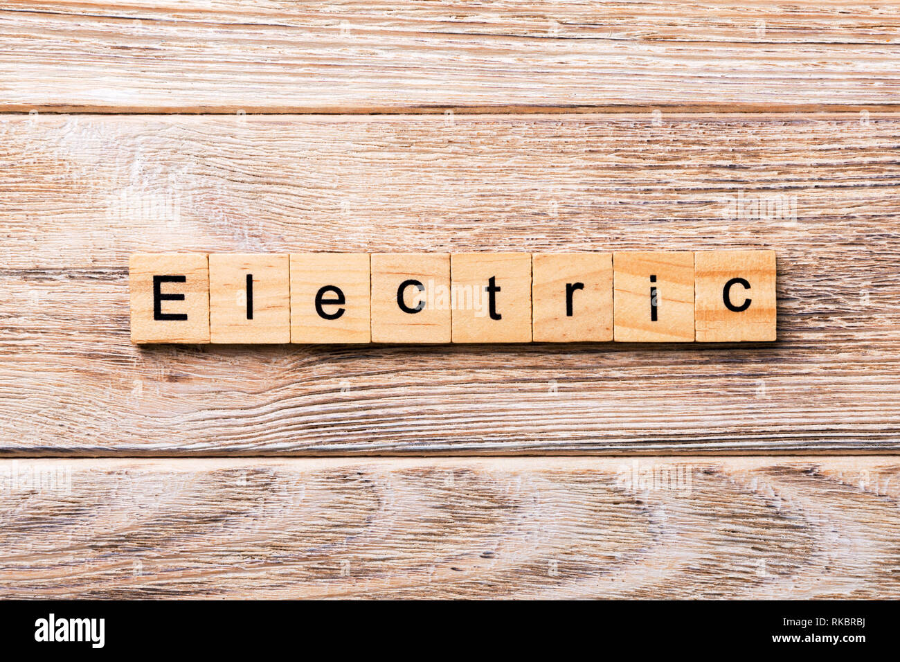 Electric word written on wood block. Electric text on wooden table for your desing, concept. Stock Photo