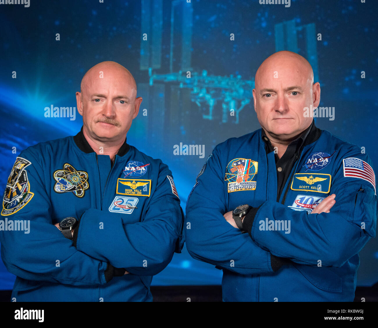 NASA astronaut Scott Kelly along with his brother, former Astronaut Mark Kelly, left, pose together prior to Scotts upcoming mission aboard the International Space Station as Expedition 45/46 Commander January 19, 2015 in Houston, Texas. Scott Kelly will become the first U.S. astronaut to spend an entire year in space Stock Photo