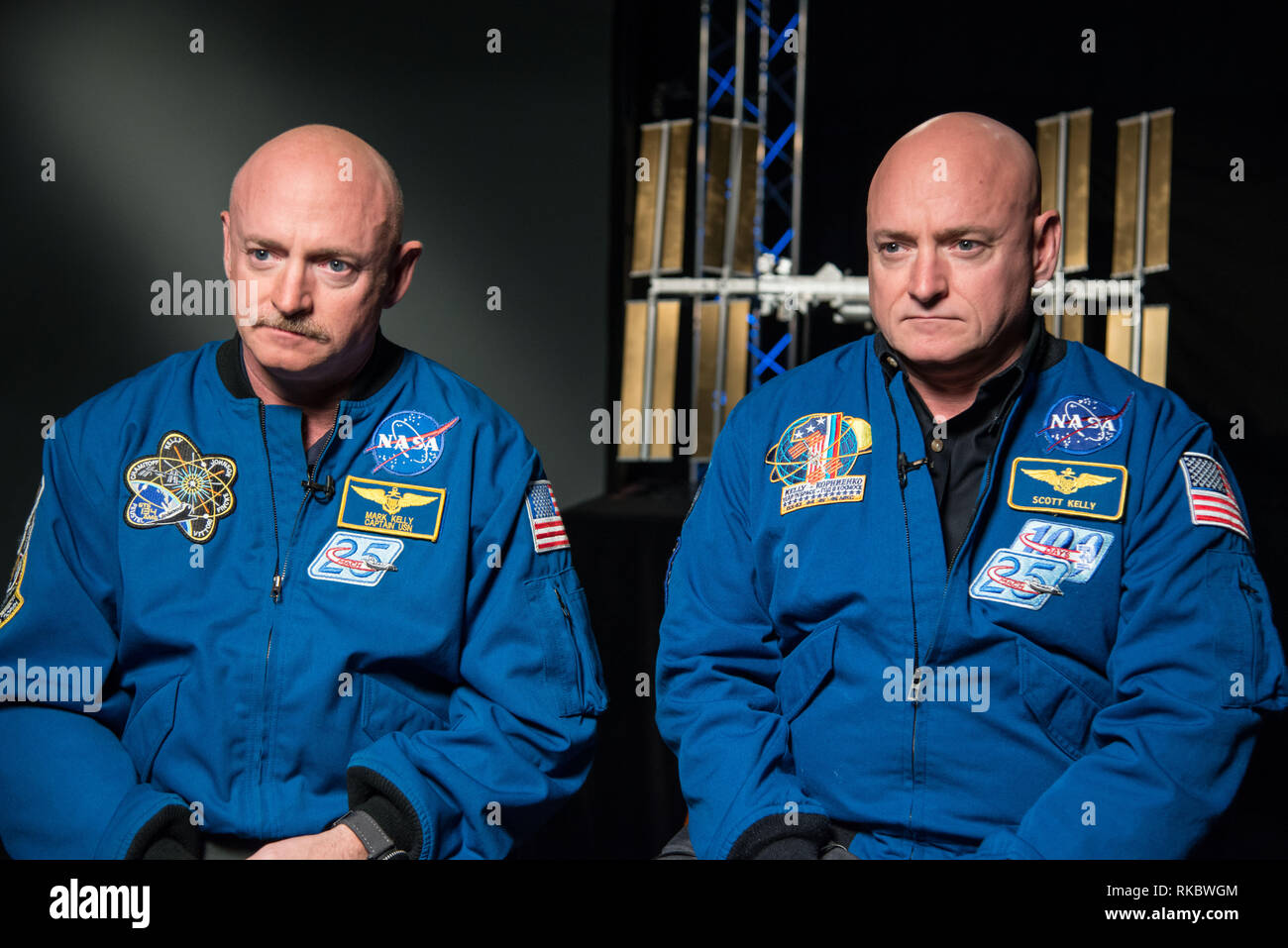 NASA astronaut Scott Kelly along with his brother, former Astronaut Mark Kelly, left, pose together prior to Scotts upcoming mission aboard the International Space Station as Expedition 45/46 Commander January 19, 2015 in Houston, Texas. Scott Kelly will become the first U.S. astronaut to spend an entire year in space Stock Photo