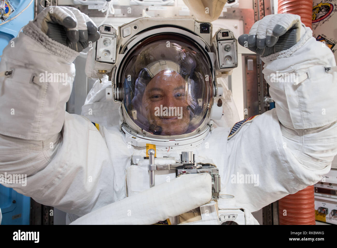 NASA astronaut Scott Tingle wearing the EMU spacesuit inside the Quest Airlock as he prepares for his first spacewalk aboard the International Space Station January 18, 2018 in Earth Orbit. McClain Stock Photo