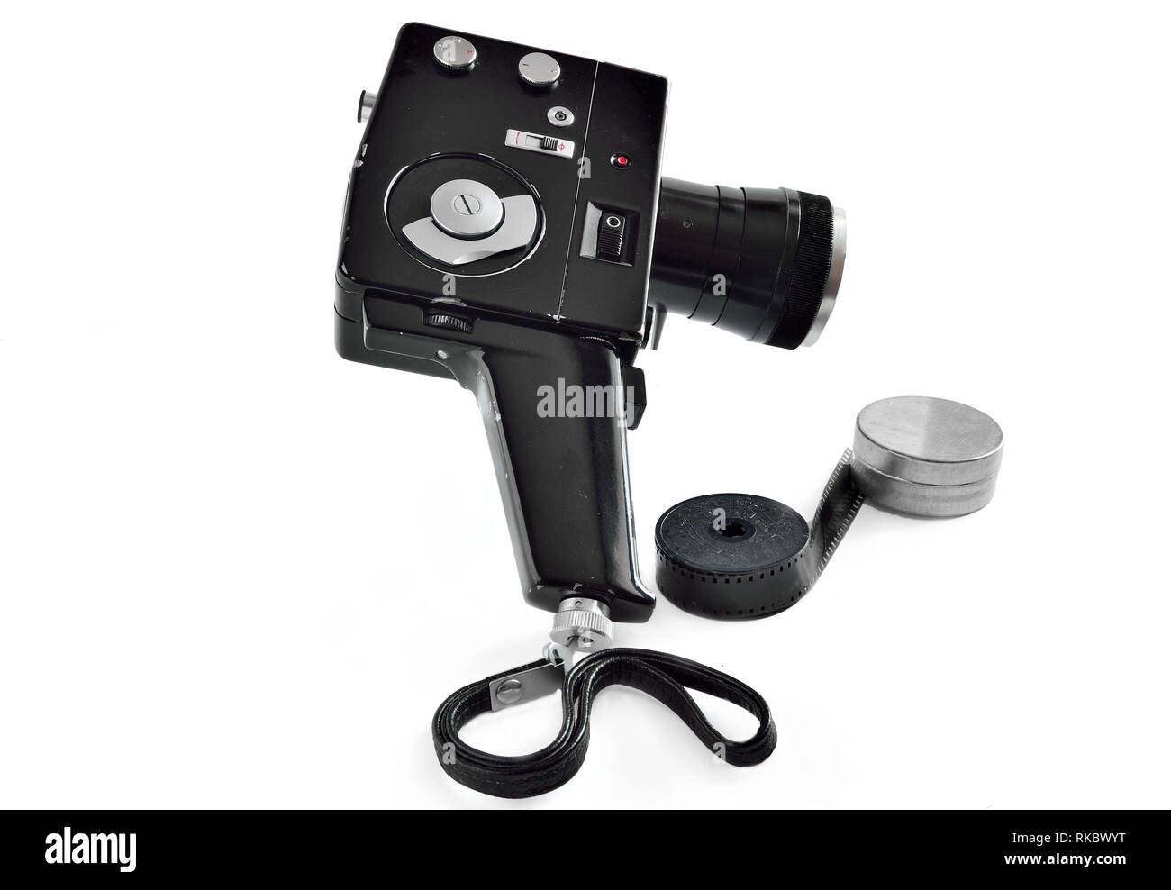 Vintage movie camera with film charged on reels isolated on white ...