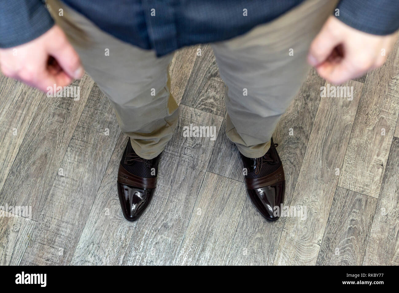 Legs of man in trousers and patent leather shoes Stock Photo