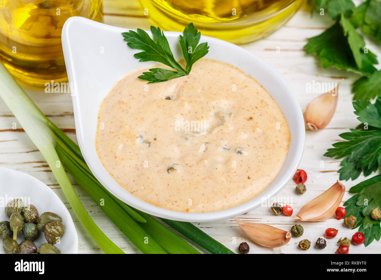 Homemade traditional French remoulade sauce in a White bowl with