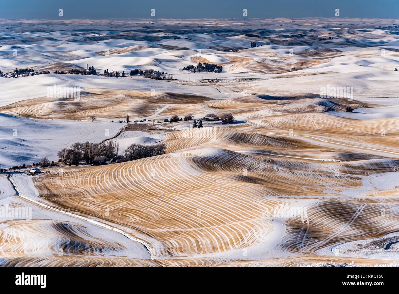 Snow Covered Farmland In The Rolling Hills Of The Palouse From Steptoe Butte. Stock Photo