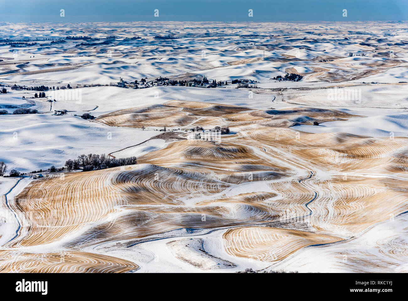 Snow Covered Farmland In The Rolling Hills Of The Palouse From Steptoe Butte. Stock Photo