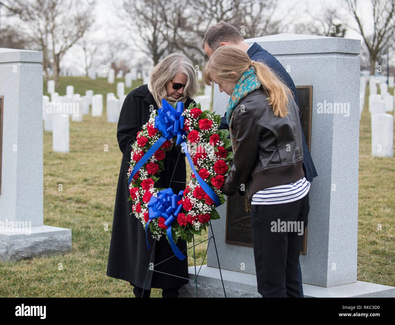 NASA Administrator Jim Bridenstine places a wreath at the Space Shuttle Columbia Memorial with Kristy Carroll, left, and daughter Vivian Carroll who were friends of Space Shuttle Columbia pilot William McCool during the Space Agency Day of Remembrance at Arlington National Cemetery February 7, 2019 in Arlington, Virginia.  Wreaths were laid in memory of those men and women who lost their lives in the quest for space exploration. Stock Photo