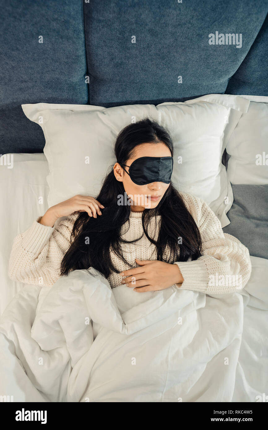 Young woman feeling amazing while sleeping at home Stock Photo