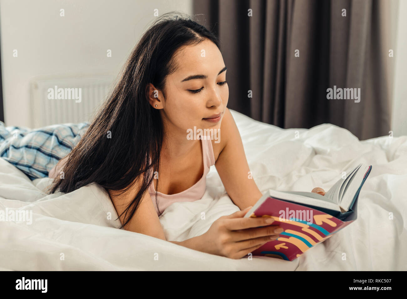 Businesswoman looking at notebook and checking working schedule Stock Photo