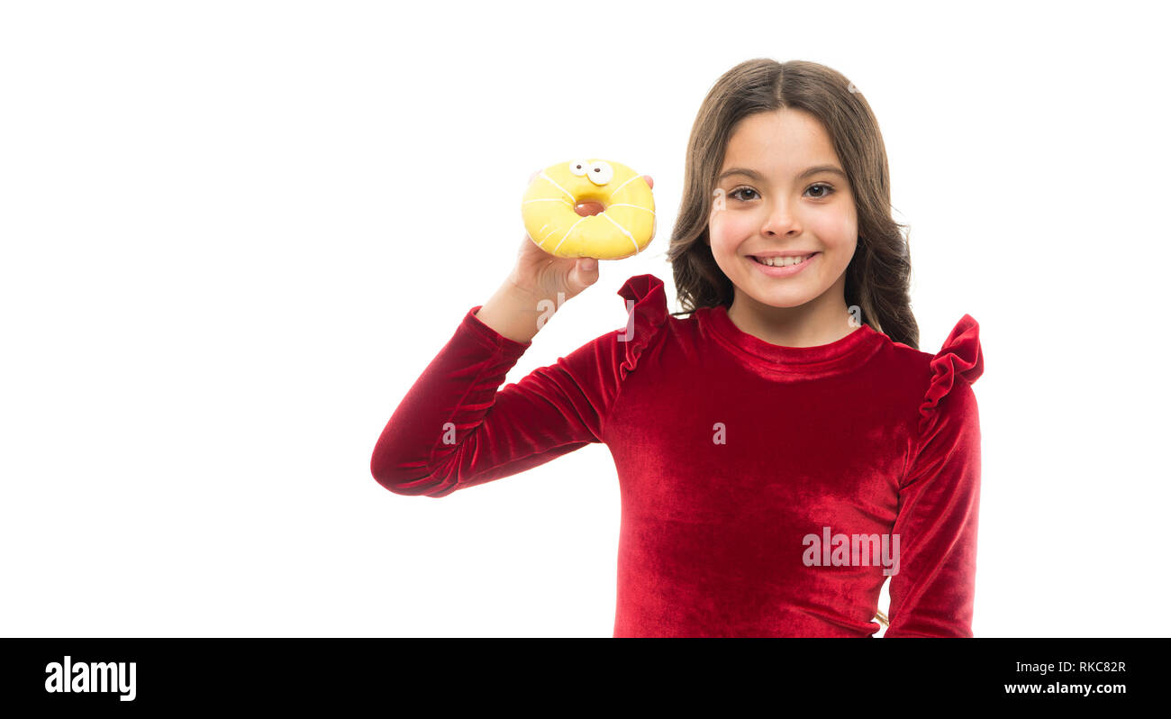 Breaking diet concept. Girl hold sweet donut white background. Child hungry for sweet donut. Sugar levels and healthy nutrition. Nutritionist advice. Sweet obsession. Happy childhood and sweet treats. Stock Photo