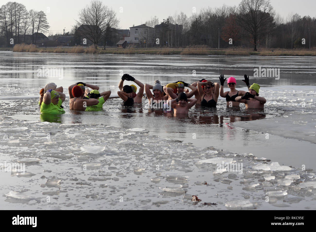 Umer, Poland. 10th Feb 2019.  A group of people winter bath in ice covered lake Credit: Slawomir Wojcik/Alamy Live News Stock Photo