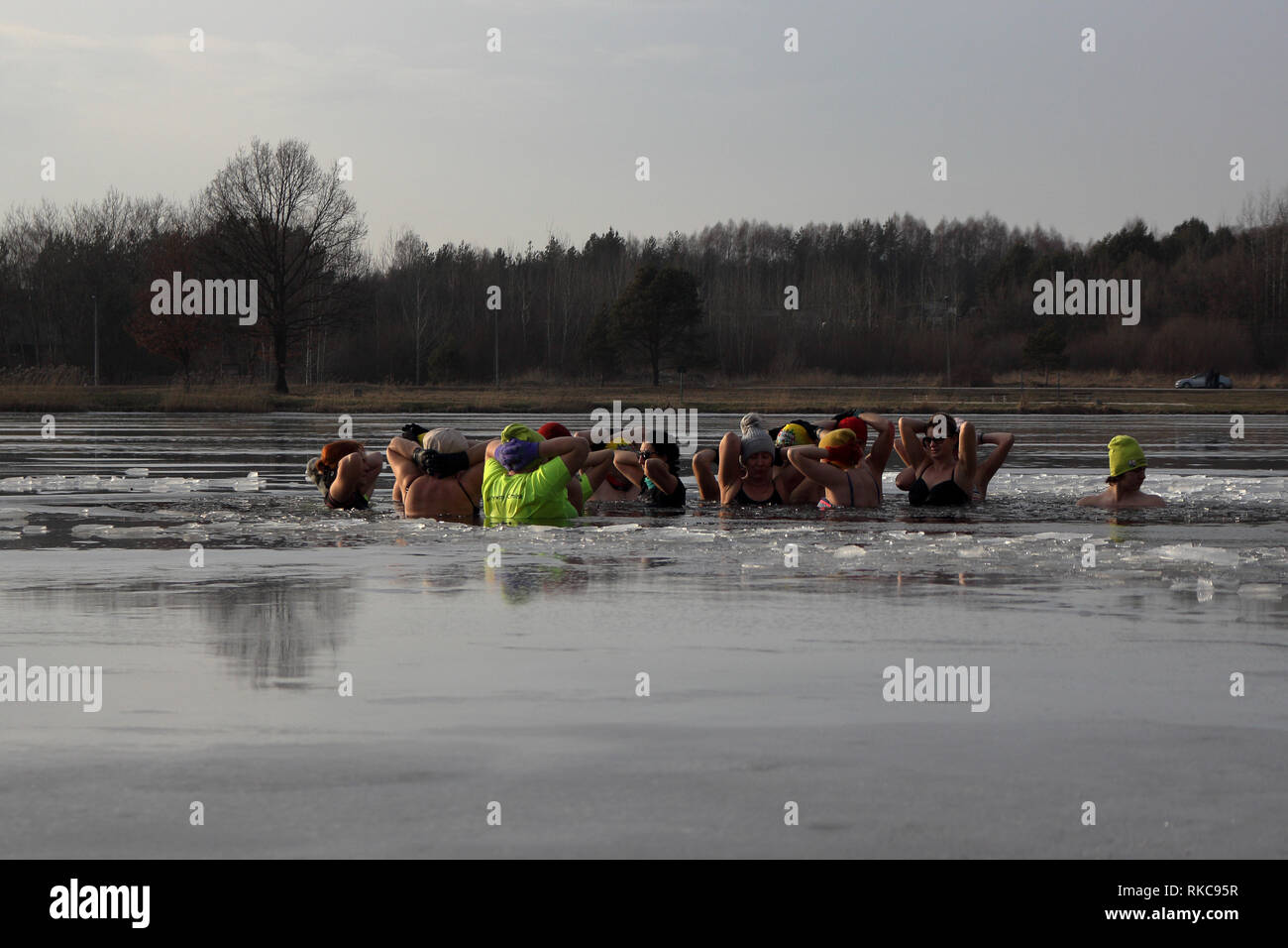 Umer, Poland. 10th Feb 2019.  A group of people winter bath in ice covered lake Credit: Slawomir Wojcik/Alamy Live News Stock Photo