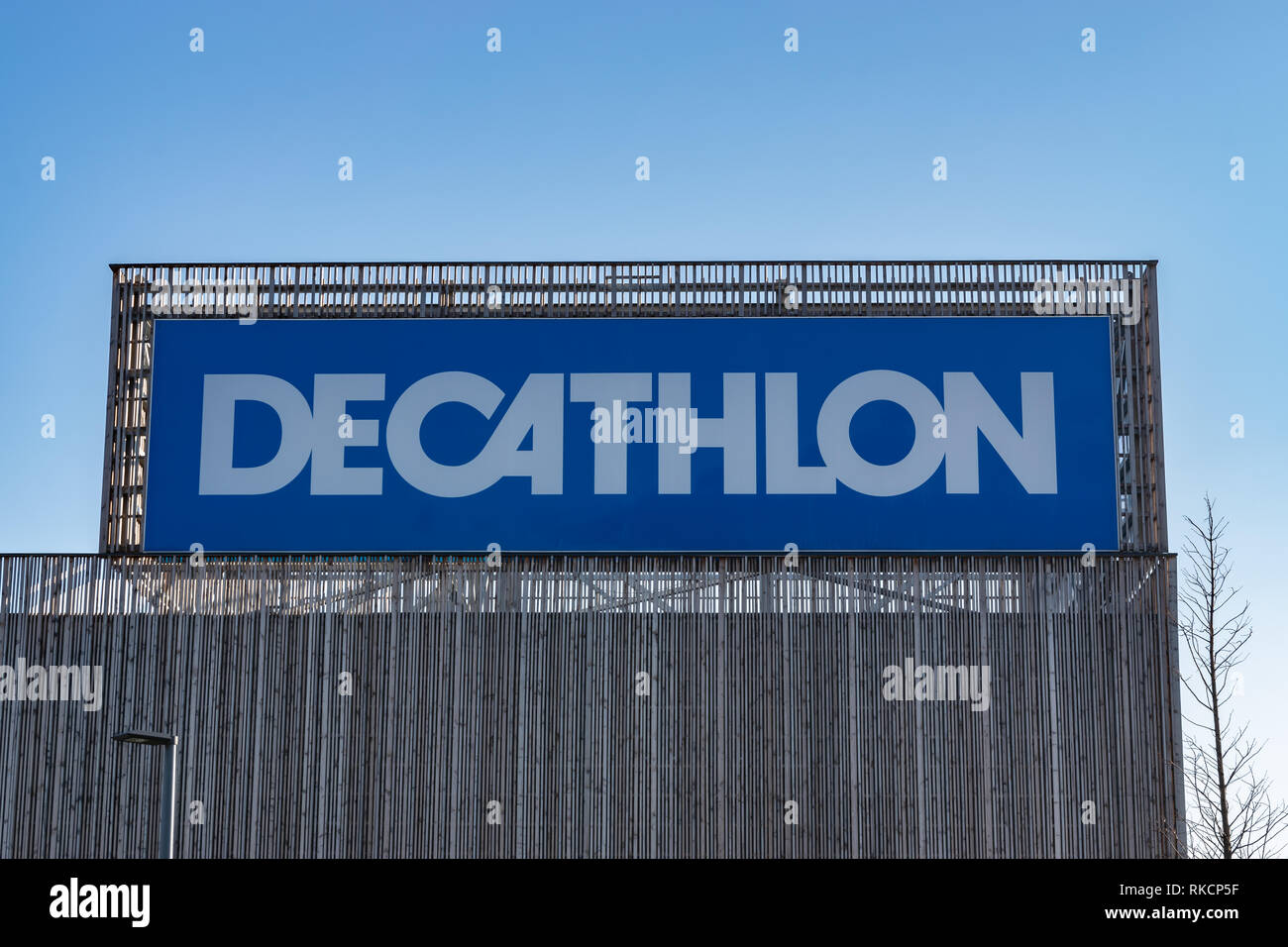 Neuville-en-Ferrain,FRANCE-January 20,2019: Decathlon store,view of the logo and wooden facade.French Shops.Decathlon is the network of sports stores. Stock Photo
