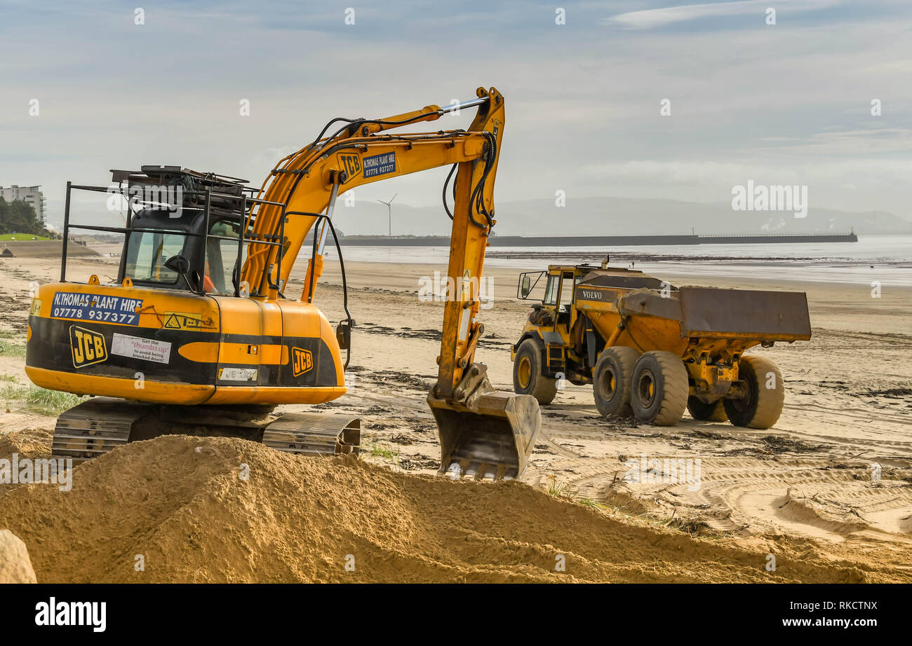 Excavator on a beach hires stock photography and images Alamy