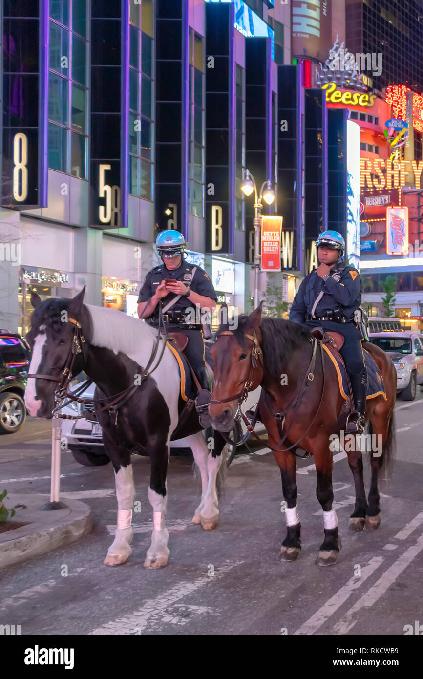 NYPD police officers on horseback in Times Square, New York City ...