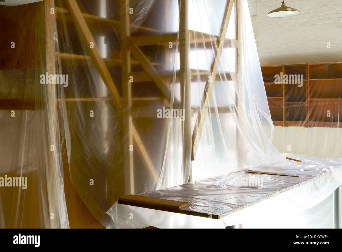 Empty space filled up with polythene, just moving in or moving out or ready for renovation. Stock Photo