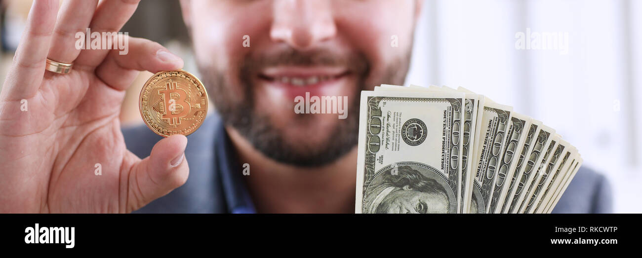 Young happy smiling businessman holding Stock Photo - Alamy