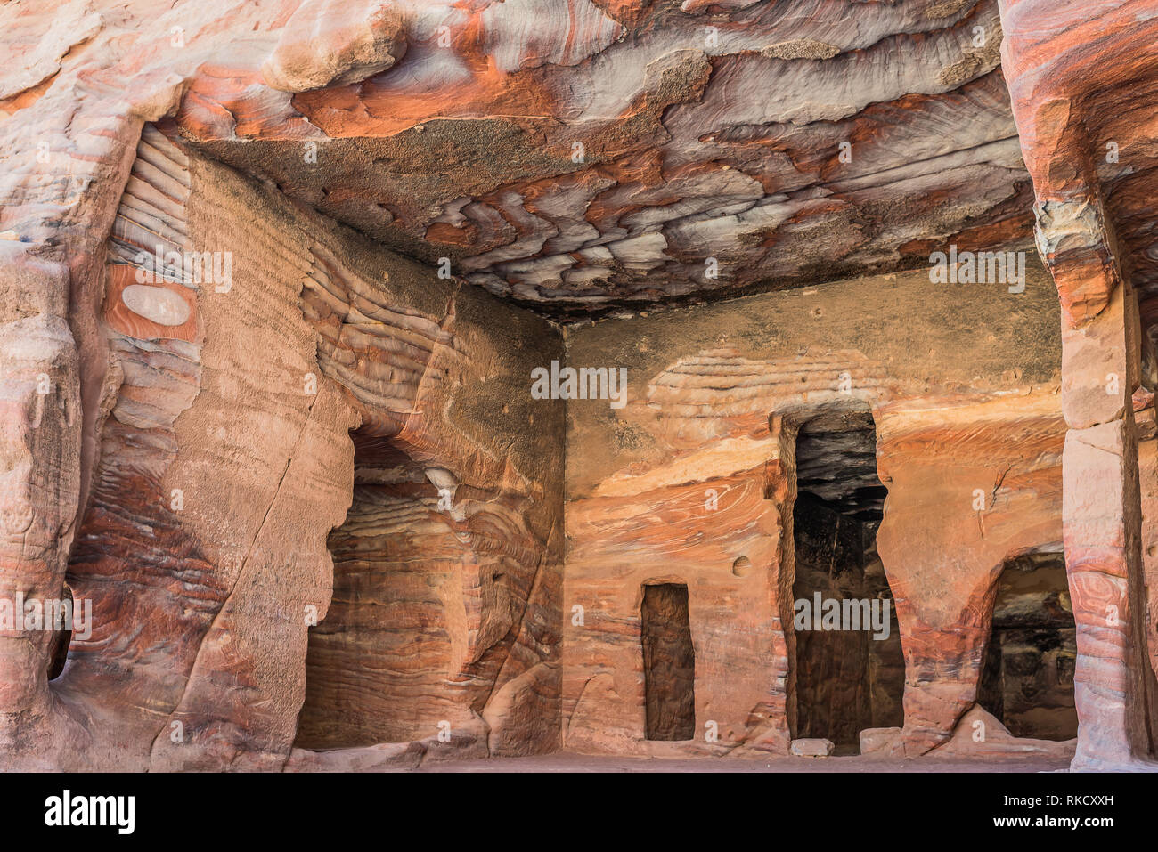 rocks caves in Nabatean Petra Jordan middle east Stock Photo