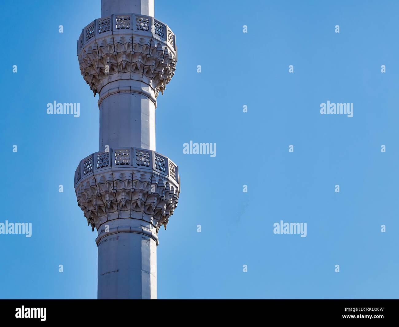 The architectural part of the building, the tower of the white minaret ...