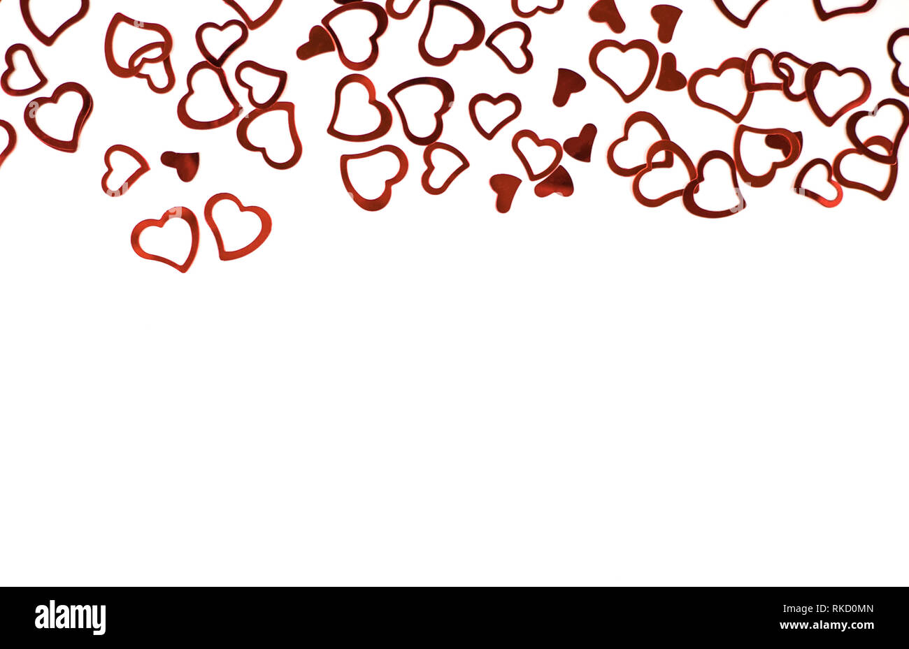 Little red confetti hearts on white background Stock Photo Alamy