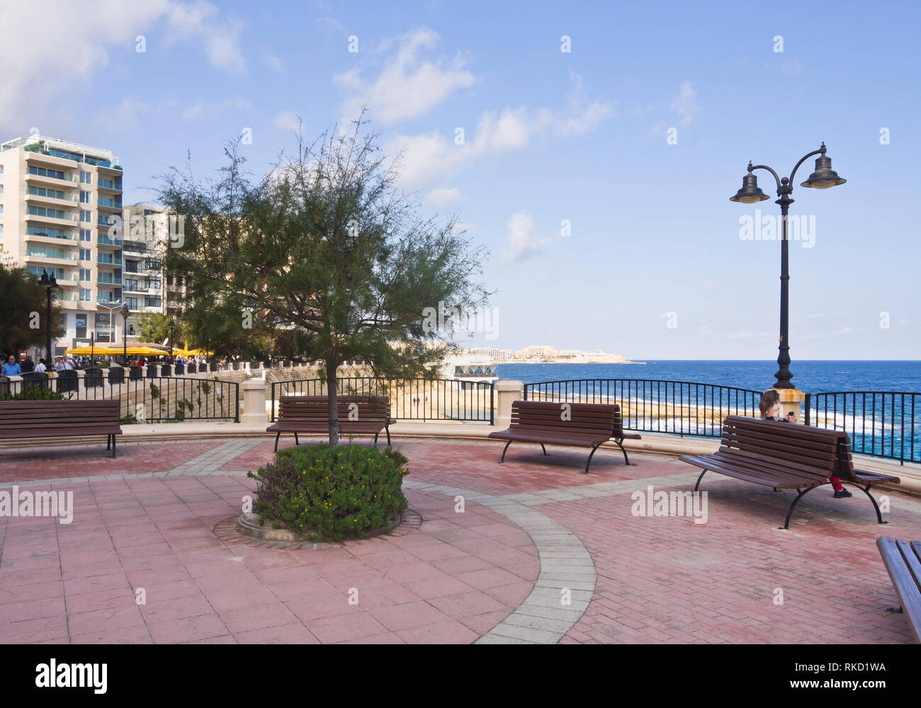 Seafront promenade in the Sliema district near Valetta in malta, sunny and inviting for a morning walk Stock Photo