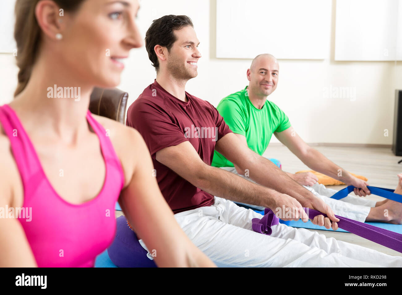 Man performing foot exercises with thera band Stock Photo