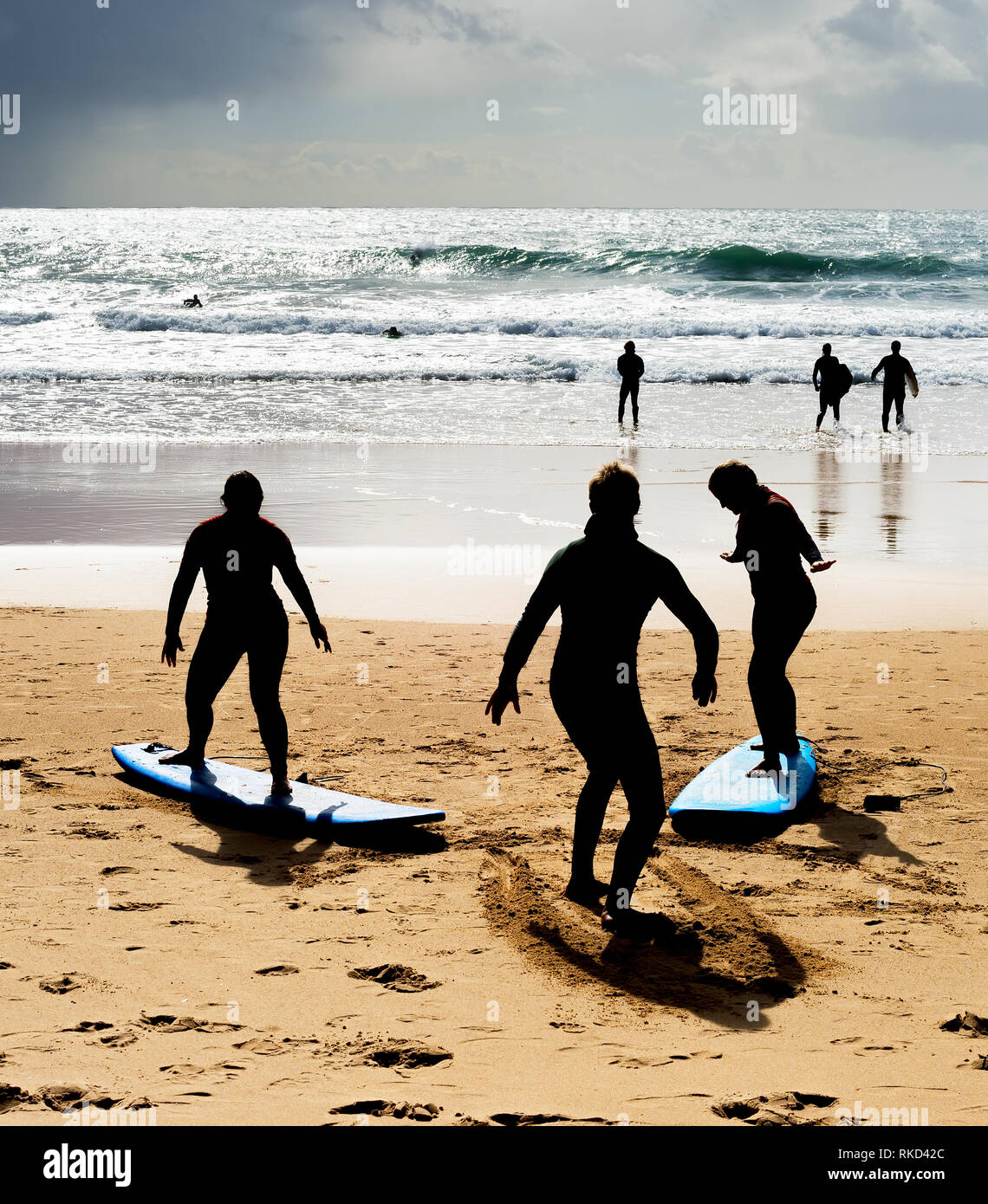 Surfing school learning how to surf at the beach. Portugal Stock Photo