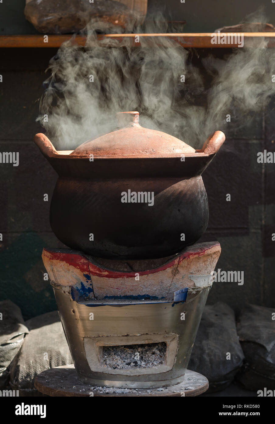 baked clay kettle with hot water on traditional stove Stock Photo Alamy