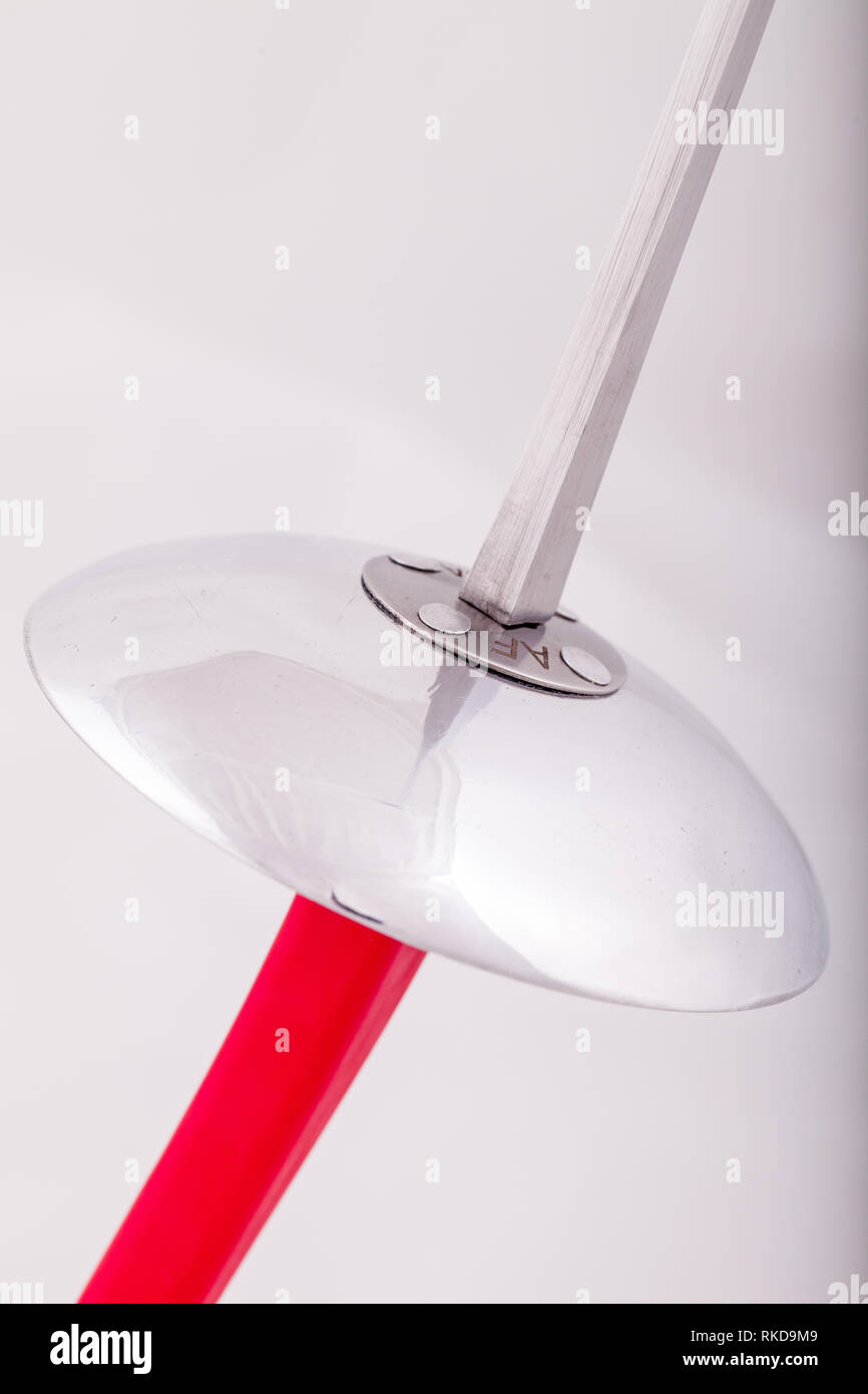 closeup of a foil sword with a red handle Stock Photo