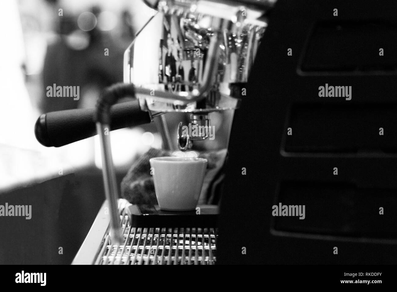espresso shot from coffee machine in coffee shop,Coffee maker in coffee shop Stock Photo