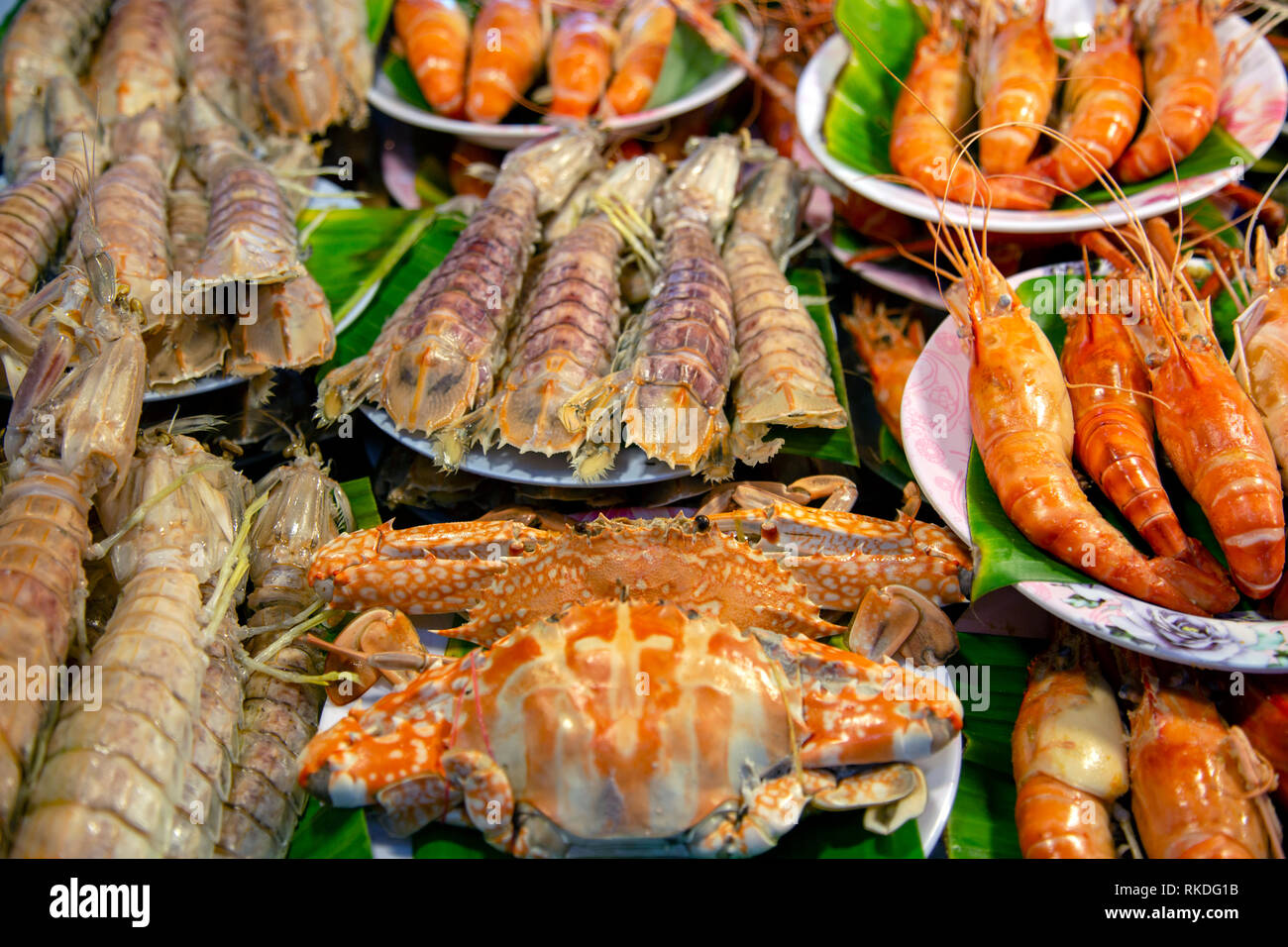 An arrangement of cooked crab, shrimp, prawn, mantis prawn shellfish