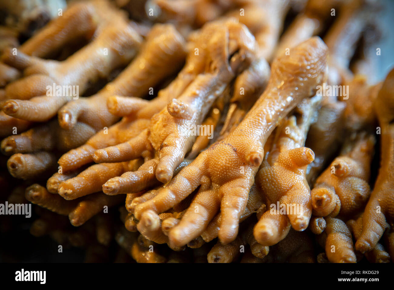 Thai Chinese style steamed cooked chicken feet at a street food market in Phuket, Thailand. Stock Photo