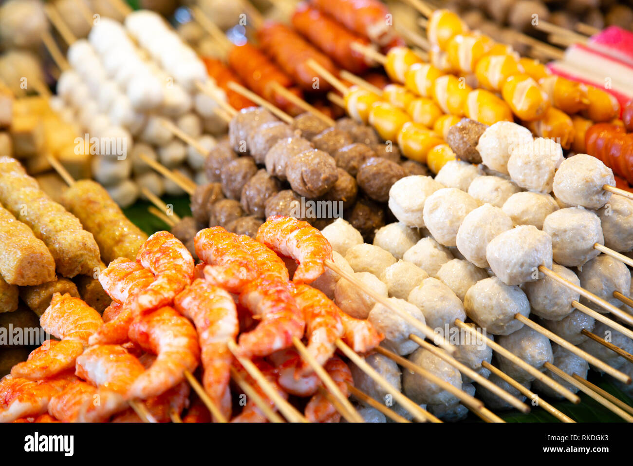 An Arrangement Of Skewered Cooked Meat And Seafood Street Food