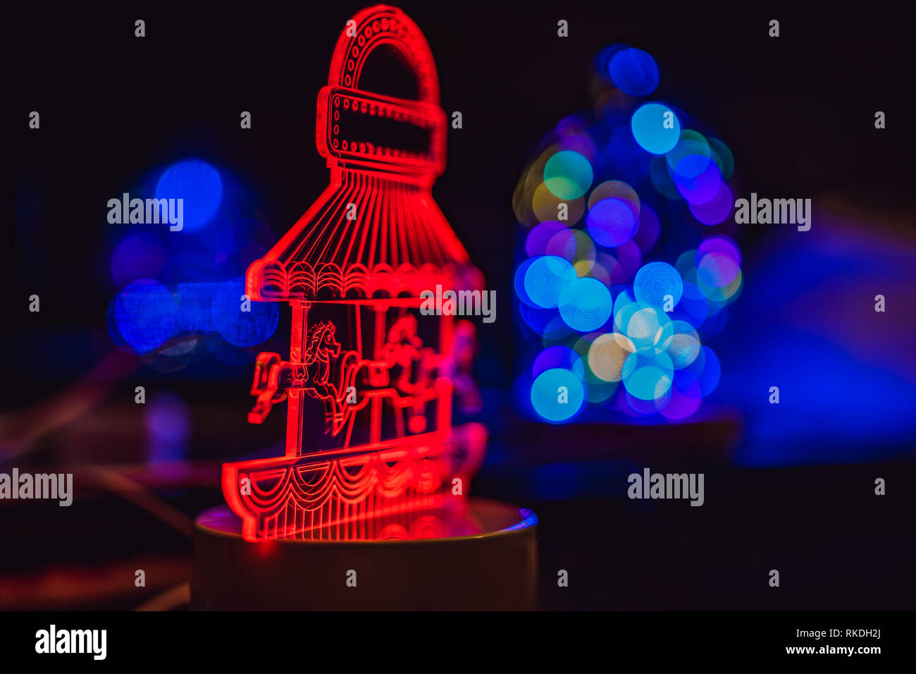 Merry Go Round carousel illuminated at night. Stock Photo