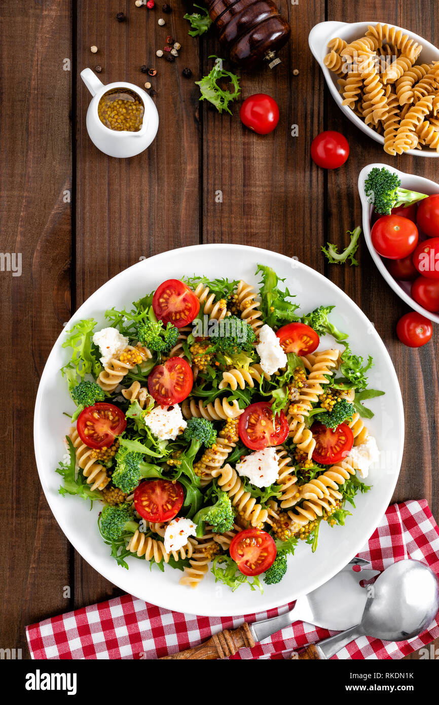 Italian Pasta Salad With Wholegrain Fusilli Fresh Tomato Cheese Lettuce And Broccoli On Wooden Rustic Background Mediterranean Cuisine Cooking Lu Stock Photo Alamy