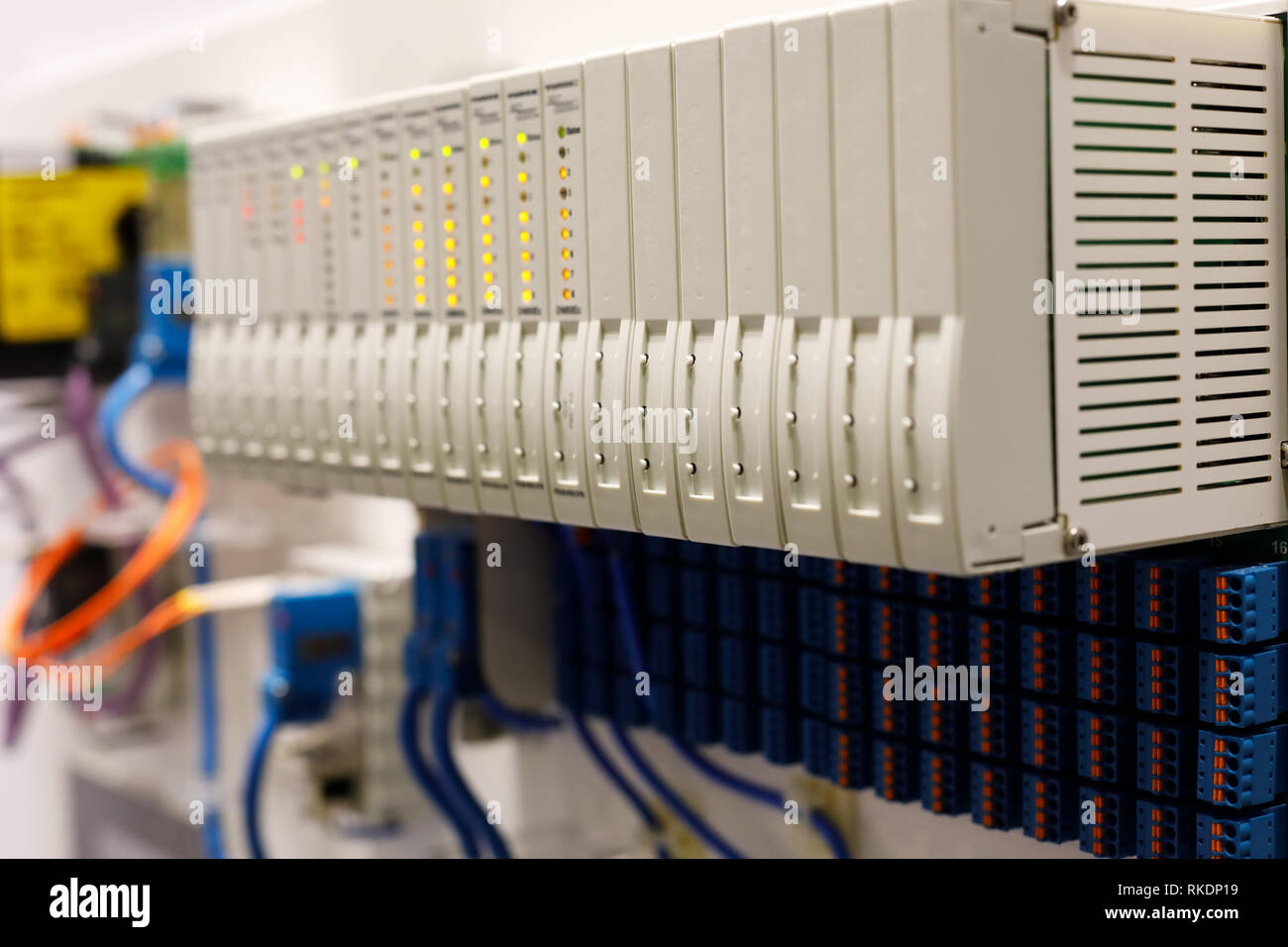 Programmable logic controller PLC modules installed in a rack. Selective focus. Stock Photo