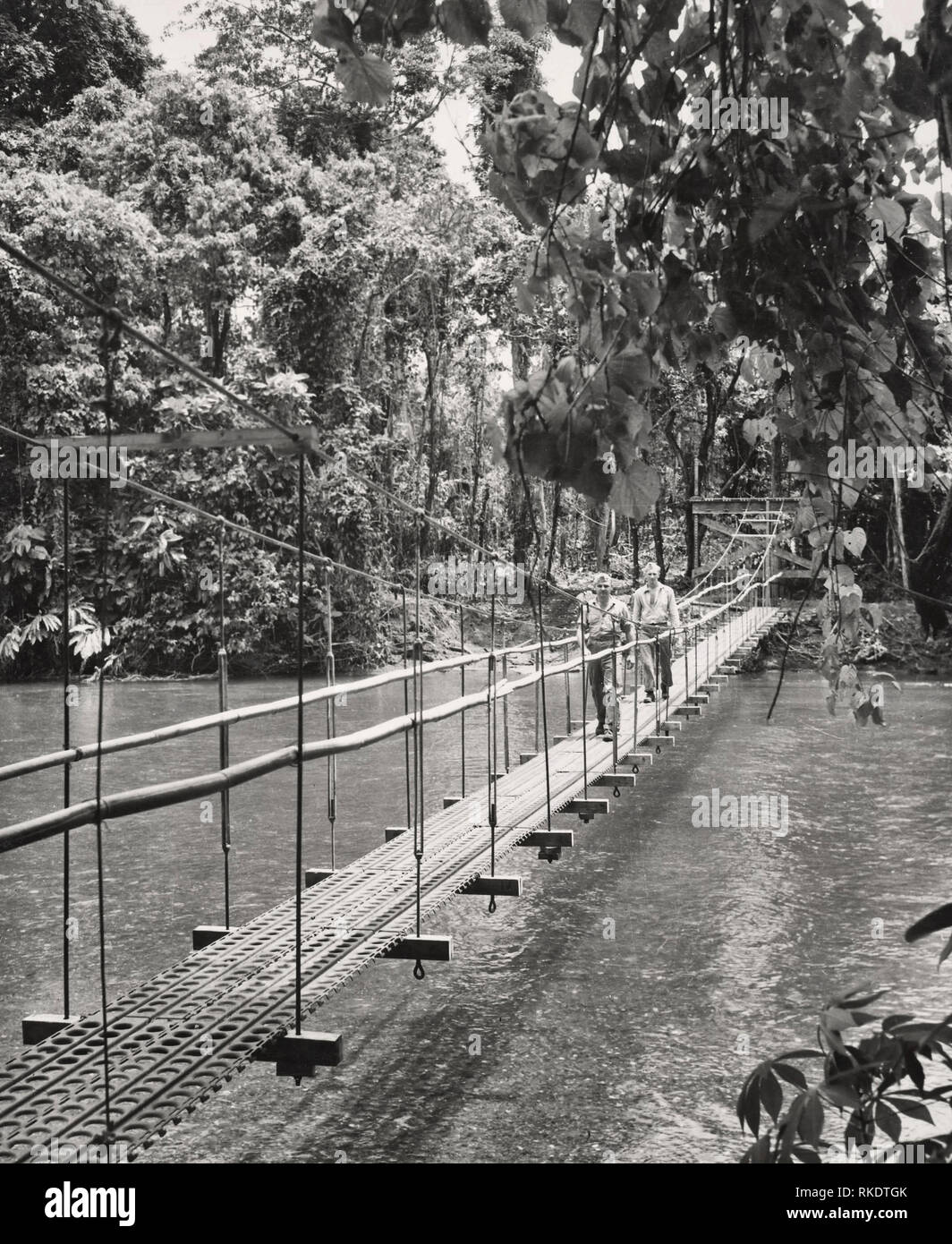 Suspension bridge built across Matanikau River on Guadalcanal in 1942 Stock Photo